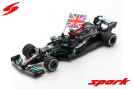 S7683 - MERCEDES-AMG PETRONAS FORMULA ONE TEAM #44 W12 E PERFORMANCE WINNER BRITISH GP 2021 LEWIS HAMILTON (HOLDING BRITISH FLAG)